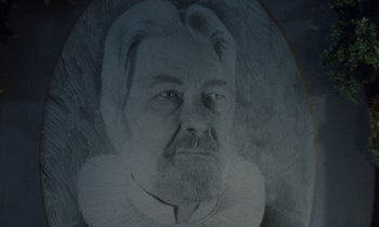 Movie still from “Babette's Feast” (1987), directed by Gabriel Axel – An old man with a beard and a white collar; Extreme Close Up shot, Low angle