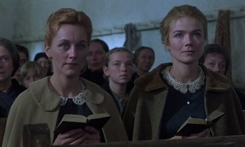Movie still from “Babette's Feast” (1987), directed by Gabriel Axel – A group of women standing next to each other holding bibles; Close Up shot, Low angle