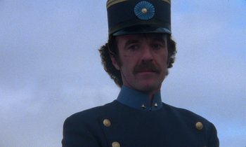 Movie still from “Babette's Feast” (1987), directed by Gabriel Axel – A person wearing a uniform; Close Up shot, Low angle