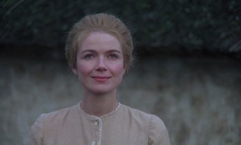Movie still from “Babette's Feast” (1987), directed by Gabriel Axel – A woman with blonde hair wearing a beige dress; Close Up shot, Over the shoulder angle