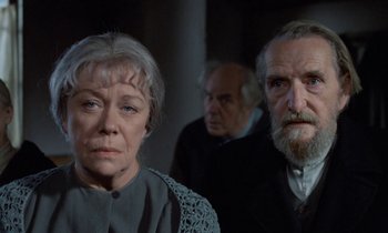 Movie still from “Babette's Feast” (1987), directed by Gabriel Axel – A group of people standing next to each other in a room; Close Up shot, Over the shoulder angle