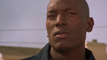 Movie still from “Baby Boy” (2001), directed by John Singleton – A person looking at the camera; Close Up shot, Low angle
