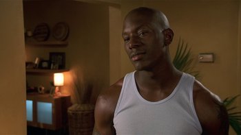 Movie still from “Baby Boy” (2001), directed by John Singleton – A person wearing a white shirt; Close Up shot, Over the shoulder angle