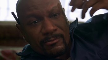 Movie still from “Baby Boy” (2001), directed by John Singleton – A man's face as he stares at the camera; Close Up shot, High angle