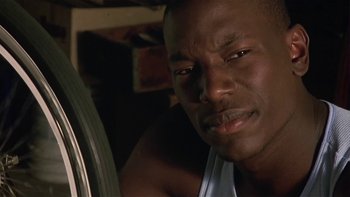 Movie still from “Baby Boy” (2001), directed by John Singleton – A person with his eyes wide open; Close Up shot, Low angle