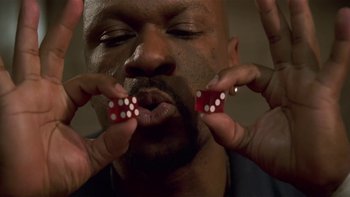 Movie still from “Baby Boy” (2001), directed by John Singleton – A person holding a pair of dices; Extreme Close Up shot, Overhead angle