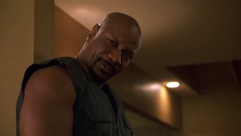 Movie still from “Baby Boy” (2001), directed by John Singleton – A man with a beard is looking at the camera; Close Up shot, Low angle