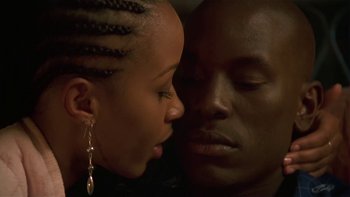 Movie still from “Baby Boy” (2001), directed by John Singleton – A man and a woman face to face with their eyes closed; Close Up shot, Low angle