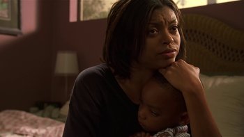 Movie still from “Baby Boy” (2001), directed by John Singleton – A woman is holding a baby in her arms; Close Up shot, Over the shoulder angle