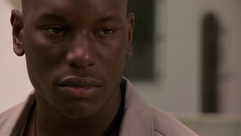 Movie still from “Baby Boy” (2001), directed by John Singleton – A man's face in a room; Close Up shot, Low angle