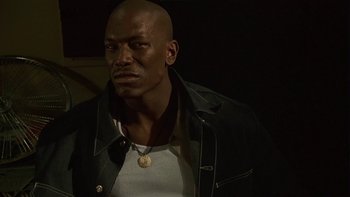 Movie still from “Baby Boy” (2001), directed by John Singleton – A man in a white shirt and a black jacket; Close Up shot, Low angle