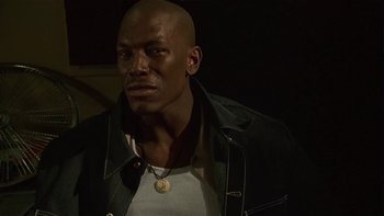 Movie still from “Baby Boy” (2001), directed by John Singleton – A man in a leather jacket looking at the camera; Close Up shot, Low angle