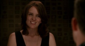 Movie still from “Baby Mama” (2008), directed by Michael McCullers – A person smiling for the camera; Close Up shot, Over the shoulder angle