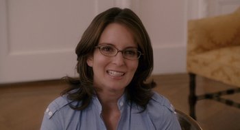 Movie still from “Baby Mama” (2008), directed by Michael McCullers – A person wearing glasses and smiling; Close Up shot, Over the shoulder angle