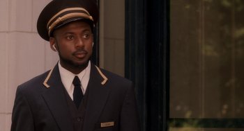 Movie still from “Baby Mama” (2008), directed by Michael McCullers – A man in a suit and a hat; Close Up shot, Over the shoulder angle