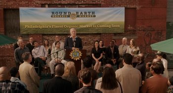 Movie still from “Baby Mama” (2008), directed by Michael McCullers – A group of people sitting in front of a microphone; Extreme Wide shot, High angle