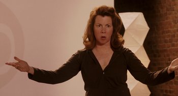 Movie still from “Baby Mama” (2008), directed by Michael McCullers – A woman standing in front of a white wall; Medium shot, Over the shoulder angle