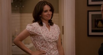 Movie still from “Baby Mama” (2008), directed by Michael McCullers – A woman standing in front of a bathroom mirror; Medium shot, Over the shoulder angle
