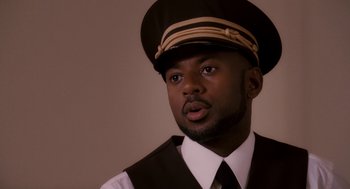 Movie still from “Baby Mama” (2008), directed by Michael McCullers – A man wearing a hat and a vest; Close Up shot, Low angle