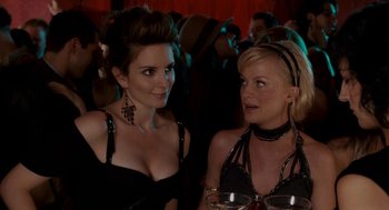 Movie still from “Baby Mama” (2008), directed by Michael McCullers – A couple of women standing next to each other at an event; Close Up shot, Over the shoulder angle