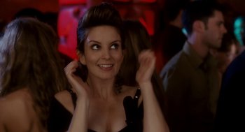 Movie still from “Baby Mama” (2008), directed by Michael McCullers – A woman in a black dress smiling at the camera; Close Up shot, Over the shoulder angle