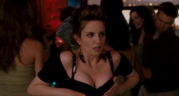 Movie still from “Baby Mama” (2008), directed by Michael McCullers – A woman in a black top is posing for a picture; Close Up shot, Over the shoulder angle