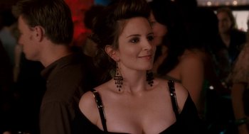 Movie still from “Baby Mama” (2008), directed by Michael McCullers – A woman in a black dress and some people in the background; Close Up shot, Over the shoulder angle