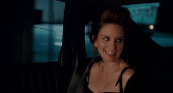 Movie still from “Baby Mama” (2008), directed by Michael McCullers – A woman sitting in the back seat of a car; Close Up shot, Over the shoulder angle