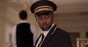 Movie still from “Baby Mama” (2008), directed by Michael McCullers – A man wearing a uniform and a hat; Close Up shot, Low angle