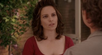 Movie still from “Baby Mama” (2008), directed by Michael McCullers – A person wearing a red shirt; Close Up shot, Over the shoulder angle