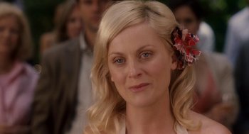 Movie still from “Baby Mama” (2008), directed by Michael McCullers – A person with a flower in her hair; Close Up shot, Over the shoulder angle