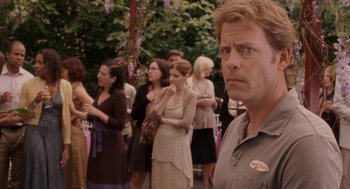 Movie still from “Baby Mama” (2008), directed by Michael McCullers – A man standing in front of a group of people; Close Up shot, Over the shoulder angle