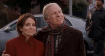 Movie still from “Baby Mama” (2008), directed by Michael McCullers – An older man and a younger woman standing next to each other; Medium shot, Low angle