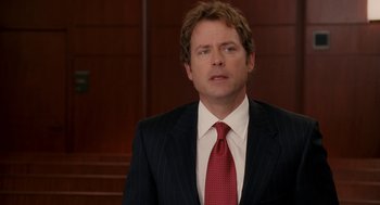 Movie still from “Baby Mama” (2008), directed by Michael McCullers – A person wearing a suit and tie; Close Up shot, Over the shoulder angle