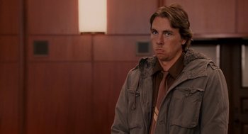 Movie still from “Baby Mama” (2008), directed by Michael McCullers – A man in a brown jacket and a brown tie; Medium shot, Over the shoulder angle