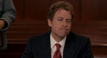 Movie still from “Baby Mama” (2008), directed by Michael McCullers – A man in a suit and a red neck tie; Close Up shot, Over the shoulder angle