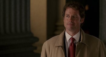 Movie still from “Baby Mama” (2008), directed by Michael McCullers – A man in a tan coat and a red tie; Close Up shot, Over the shoulder angle