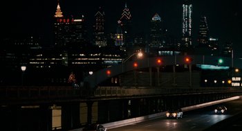 Movie still from “Baby Mama” (2008), directed by Michael McCullers – A view of a city at night from a bridge; Extreme Wide shot, High angle