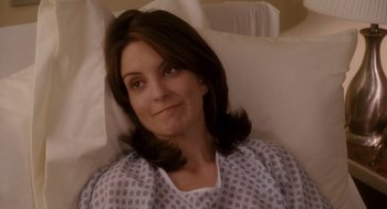 Movie still from “Baby Mama” (2008), directed by Michael McCullers – A person laying in a hospital bed; Medium shot, Over the shoulder angle