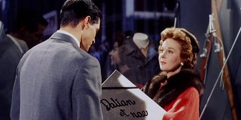 Movie still from “Back Street” (1961), directed by David Miller – A man and a woman are looking at each other; Medium shot, Over the shoulder angle