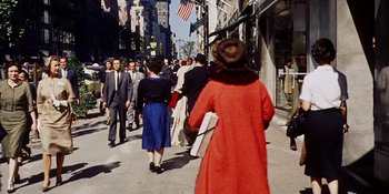 Movie still from “Back Street” (1961), directed by David Miller – A crowd of people walking down a sidewalk; Wide shot, High angle
