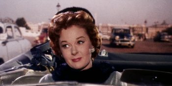 Movie still from “Back Street” (1961), directed by David Miller – An older woman in a black and white outfit; Close Up shot, Low angle