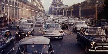 Movie still from “Back Street” (1961), directed by David Miller – A bunch of cars that are in the street; Extreme Wide shot, High angle