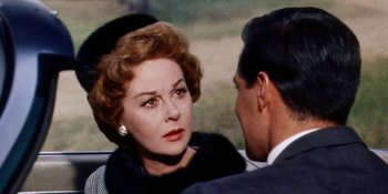 Movie still from “Back Street” (1961), directed by David Miller – An older woman and a younger man in a car; Close Up shot, Over the shoulder angle