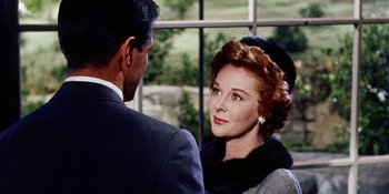 Movie still from “Back Street” (1961), directed by David Miller – An older woman wearing a hat and a fur coat; Close Up shot, Over the shoulder angle
