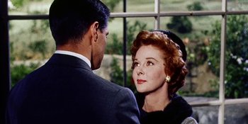 Movie still from “Back Street” (1961), directed by David Miller – An older man and a younger woman looking at each other; Close Up shot, Over the shoulder angle