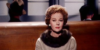 Movie still from “Back Street” (1961), directed by David Miller – A woman wearing a hat and a fur collar; Close Up shot, Low angle