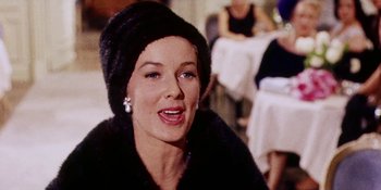 Movie still from “Back Street” (1961), directed by David Miller – A person wearing a hat; Close Up shot, Low angle