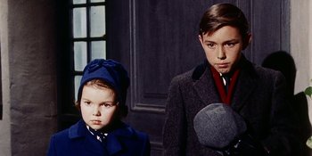Movie still from “Back Street” (1961), directed by David Miller – Two young boys in a room with a window; Medium shot, Low angle