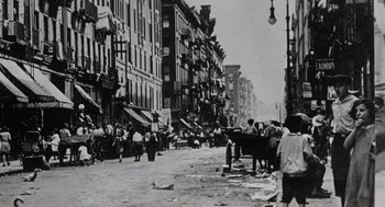 Movie still from “Back to School” (1986), directed by Alan Metter – A black and white photo of a city street; Extreme Wide shot, High angle